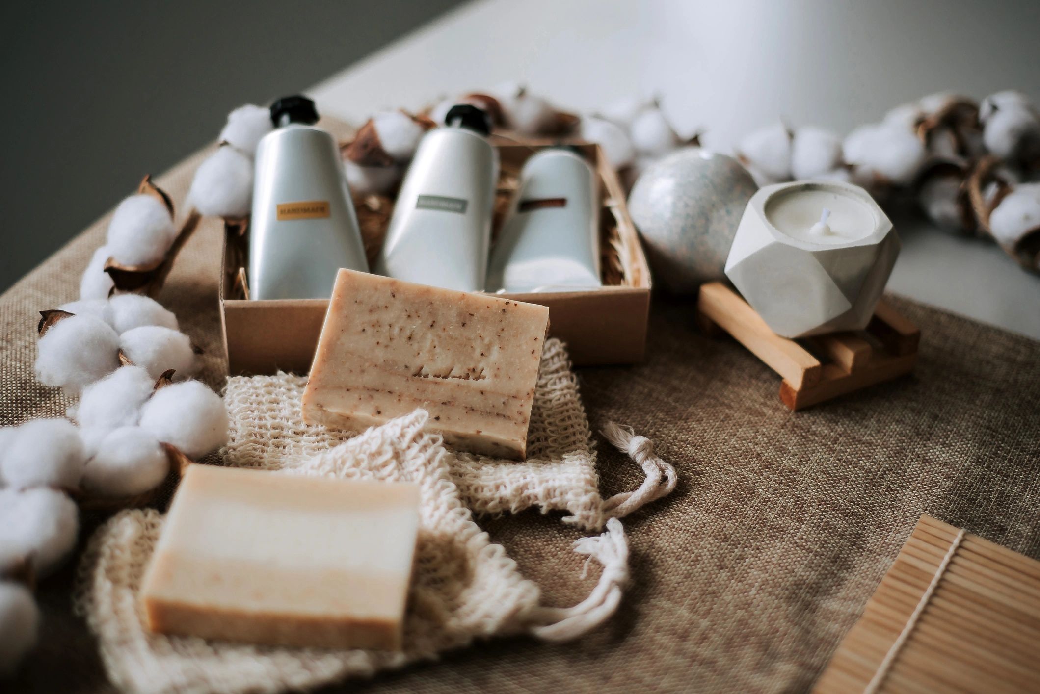 Handmade soap and natural home skincare products on a rustic table