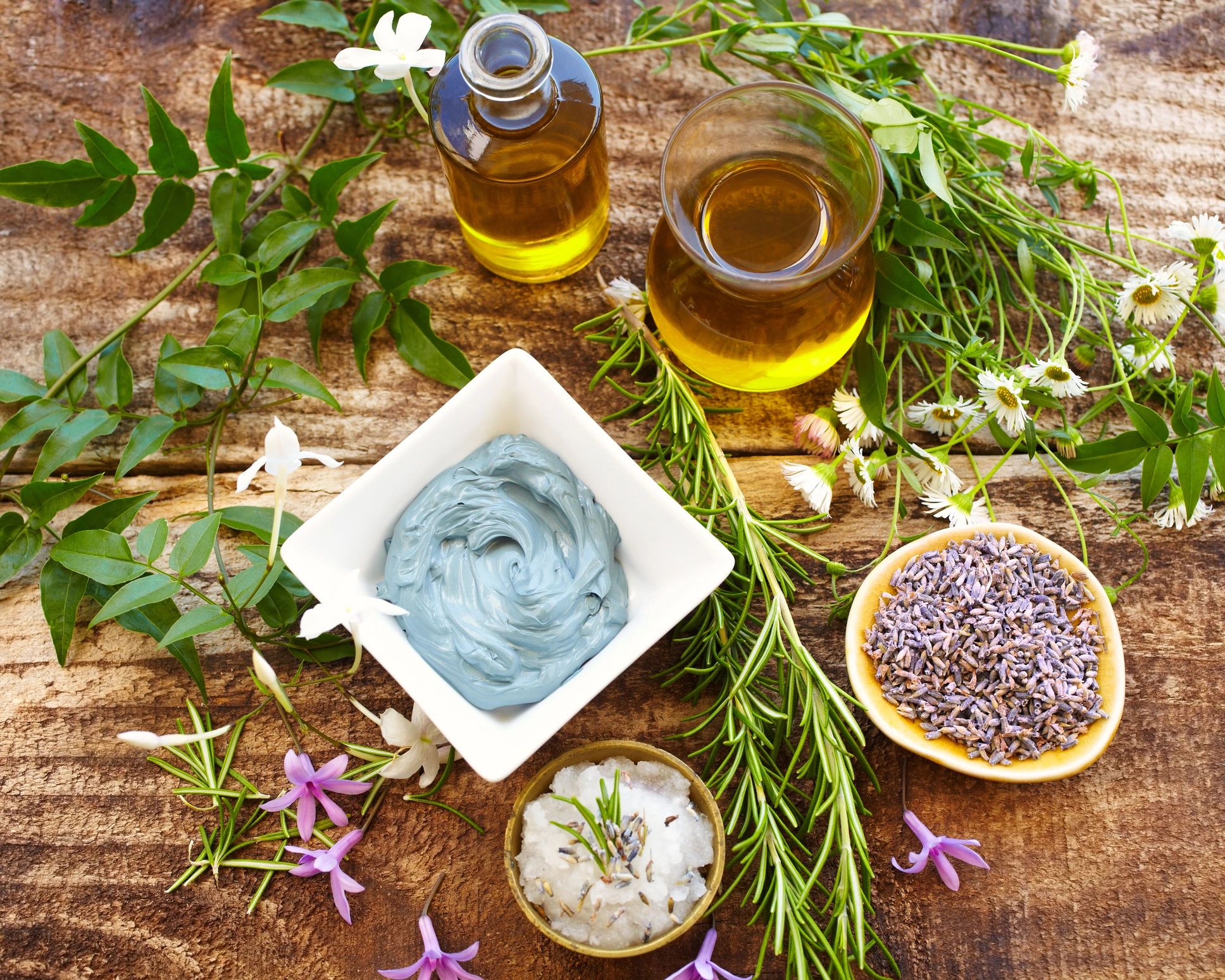 Botanical spa ingredients on a rustic wood surface
